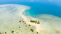 Tropical island with mangroves and turquoise lagoons on a coral reef, top view.Fraser Island, seascape Honda Bay