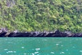 Tropical island with overhang cliff