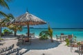 Tropical island with palm trees and amazing vibrant beach in Maldives. Parasol in sea tropical Maldives romantic atoll island