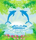 Tropical island paradise with leaping dolphins Royalty Free Stock Photo