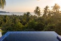 Tropical island pool villa resort with sea view on palm trees and sea horizon from the high Royalty Free Stock Photo