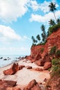 Tropical island red cliff  rock beach with blue sky and clouds in summer, tranquil serene ocean scenery. Fang Daeng in Prachuap Royalty Free Stock Photo