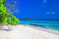 Tropical island with sandy beach, overwater bungalows and tourquise clear water, Maldives Royalty Free Stock Photo