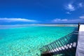 Tropical island with sandy beach with palm trees and tourquise clear water. Royalty Free Stock Photo