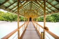 Tropical island scene with walkway leading onto island Royalty Free Stock Photo