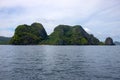 Tropical island in still sea. Green mountain marine landscape. Philippines island hopping banner template
