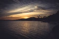 Tropical island sunset dark landscape beach vintage palm trees coastline Royalty Free Stock Photo