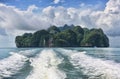 Tropical island view and a trace of speedboat