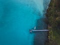 Tropical island and wooden pier with boat, top down view Royalty Free Stock Photo