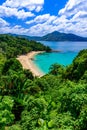 Tropical Laem Sing beach. Beautiful turquoise bay and people relaxing on beach. Paradise coast of Phuket, Thailand