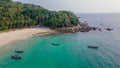 Tropical lagoon with boats near beautiful beach and palm trees Royalty Free Stock Photo