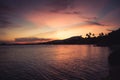 Tropical landscape beach vintage orange sunset sky palm trees coastline Royalty Free Stock Photo