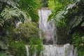 Tropical landscape. Beautiful hidden waterfall in rainforest. Adventure and travel concept. Nature background. Slow shutter speed Royalty Free Stock Photo