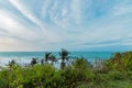 Tropical landscape on the cliff of Balangan beach, Bali, Indonesia, Asia. Sunny day, beautiful blue sky, green palms. Royalty Free Stock Photo