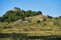 Tropical landscape with hills, palm trees and stones with blue sky Royalty Free Stock Photo