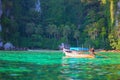 Tropical landscape, traditional long tail boat, Thailand Phi-Phi island.