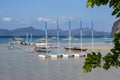 Tropical landscape with traditional Pilippines boats. Palawan island lagoon with mountains on horizon.