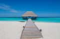 Tropical landscape with wooden bridge and hut on the water at Maldives Royalty Free Stock Photo