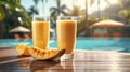 tropical mango cocktail, delightful treat to enjoy while lounging by pool, under warm embrace of sunlit sky.Ai generated Royalty Free Stock Photo