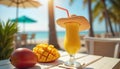Tropical mango milkshake on sunny beach table, vibrant refreshment for summer vacation Royalty Free Stock Photo