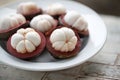 Tropical mangosteen fruit on wood table