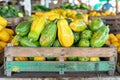 Tropical market stall with exotic papayas, colorful umbrellas, and palm leaves for vacation vibes