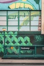 Tropical mural and subway entrance in the Lower East Side, Manhattan, New York City