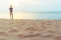 Tropical nature clean beach and white sand in summer with sun light blue sky and bokeh.