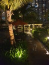 Tropical night walkway to pool