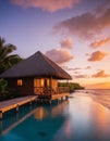 Tropical overwater bungalow at sunset Royalty Free Stock Photo