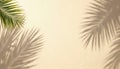 Tropical palm leaf shadow on beige sand background. Sunlight creates natural light patterns on calm, serene surface. Minimal Royalty Free Stock Photo