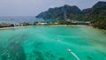 Tropical panoramic landscape with boat in the ocean at Phi Phi islands in Thailand.