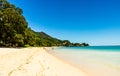 Tropical paradise beach with palms, white sand, and turquoise water at the Police Bay in Mahe Island, Seychelles Royalty Free Stock Photo