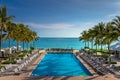 Tropical paradise: beach with pool, gazebos and palm trees, Montego Bay, Jamaica Royalty Free Stock Photo