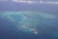 Tropical paradise beautiful island viewed from above, aerial view on crystal clear turquoise blue and green waters