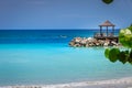 Tropical paradise: caribbean beach with pier and gazebo, Montego Bay, Jamaica Royalty Free Stock Photo