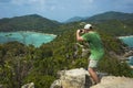 Tropical paradise island in Thailand, Koh Tao. Male tourist taking photo from John-Suwan Viewpoint