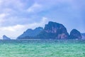 Tropical paradise turquoise water beach and limestone rocks Krabi Thailand