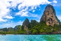 Tropical paradise turquoise water beach and limestone rocks Krabi Thailand