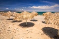 Tropical parasols at Maleme beach on Crete, Greece Royalty Free Stock Photo