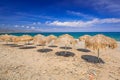 Tropical parasols at Maleme beach on Crete Royalty Free Stock Photo