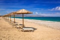 Tropical parasols at Maleme beach on Crete Royalty Free Stock Photo