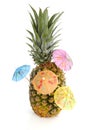 Tropical pineapple with cororful umbrellas