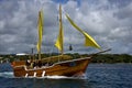 Tropical pirate boat and coastline Royalty Free Stock Photo