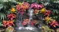 Tropical Plants and Waterfall in Lush Indoor Garden Display Royalty Free Stock Photo