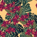 Tropical red hibiscus flowers and monster leaves seamless pattern. Palm tree leaves decoration on yellow background. Royalty Free Stock Photo