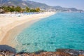 Tropical resort sea beach on summer vacation. Beach with white sand, Alanya Turkey. Royalty Free Stock Photo