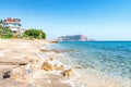 Tropical resort sea beach on summer vacation. Beach with white sand and rocks Royalty Free Stock Photo