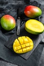 Tropical ripe mango fruit. Black background. Top view Royalty Free Stock Photo