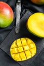 Tropical ripe mango fruit. Black background. Top view Royalty Free Stock Photo